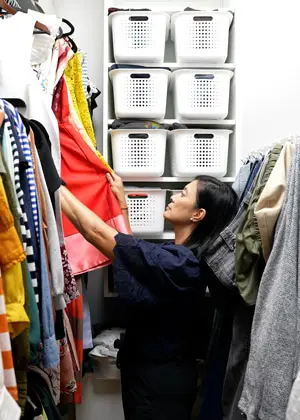 person arranging their custom closet