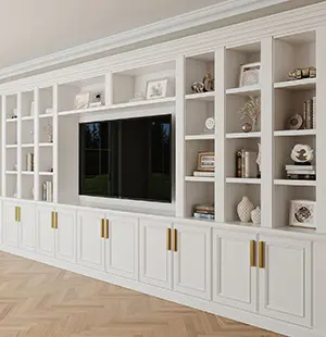 Custom built-in wall unit in white with gold hardware, featuring open shelving for display and concealed lower cabinets for storage