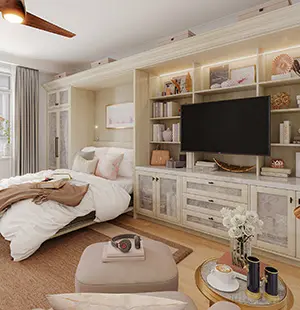 Custom built-in bedroom wall unit with soft neutral finishes, glass-front cabinetry, and integrated shelving surrounding a mounted TV