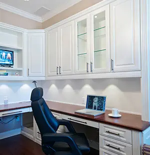 Custom home office with Undercabinet lighting and High Pressure Laminate Countertop