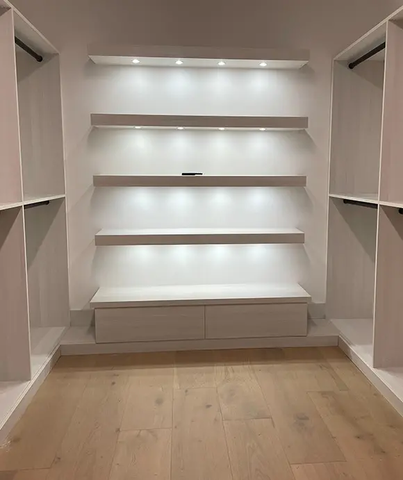 Walk in closet with Full depth soft close drawers and Purse and Shoe display area