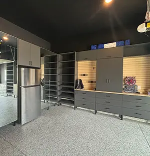 Garage storage cabinets in slate grey with slatwall organizer and built in fridge