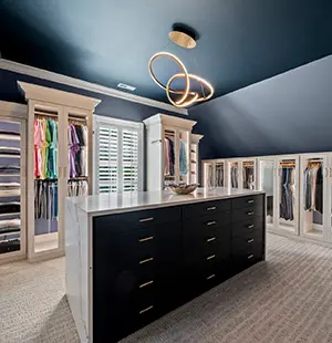 Custom walk in closet with Artic Groovz glass doors with strip lighting