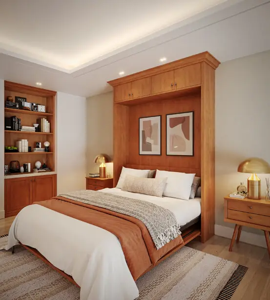 Raised-panel wood wall bed in open position with built-in overhead cabinetry