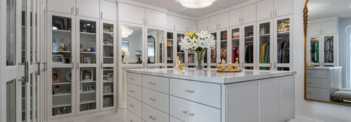 custom built walk in closet in light grray