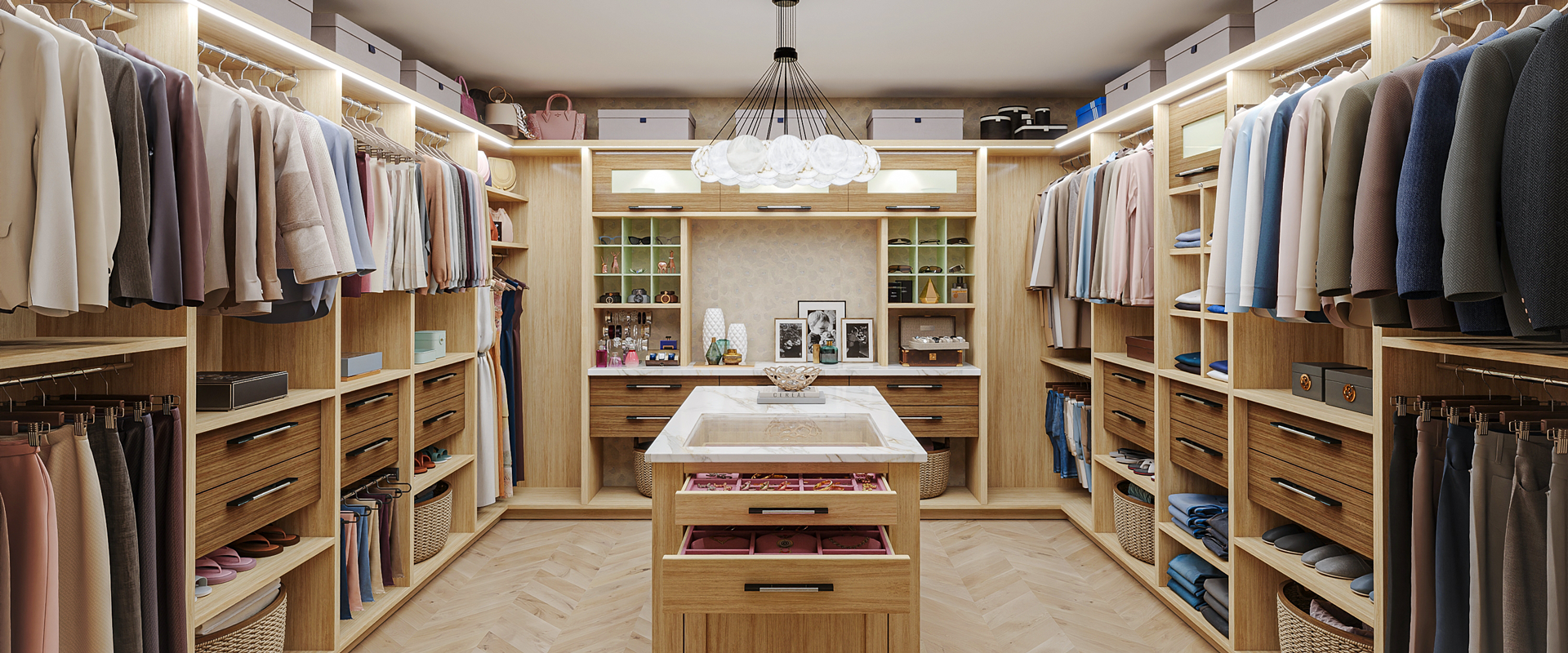 Wood-toned walk-in closet with hanging storage, drawer organization, and a central island.