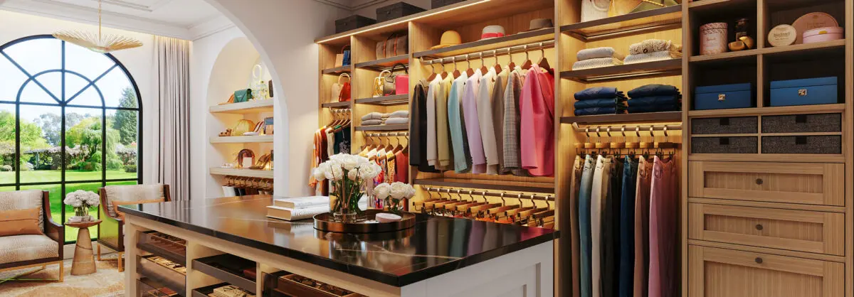 beautiful custom walkin closet with an island in light brown
