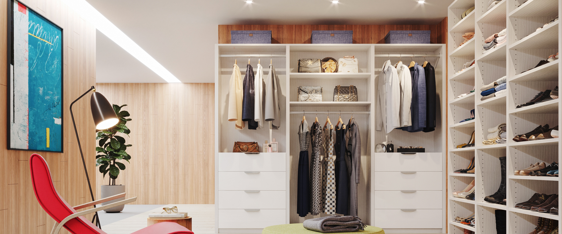 Open wardrobe space with shoe shelving, hanging storage, and a lounge chair beneath a sloped ceiling.