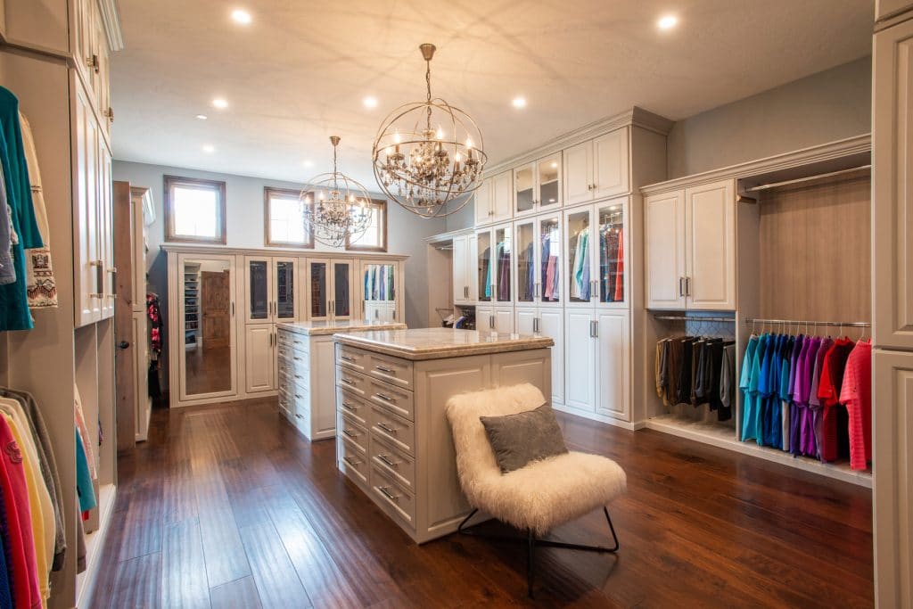 beautiful large walk in closet with 2 island