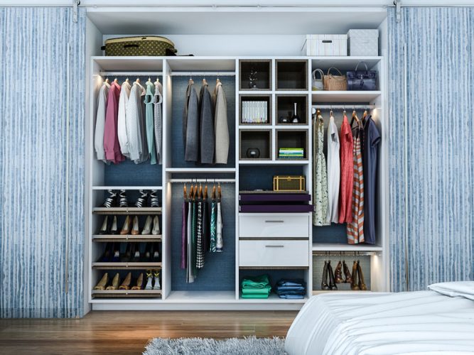 Mobile image of reach-in closet system with slanted shoe shelves, hanging rods and drawers.