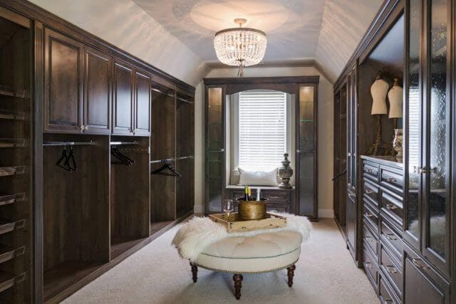 A closet finished with dark wood veneer