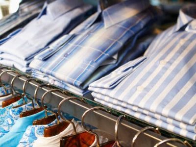 folded shirts on a shelf