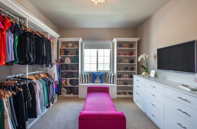 Dressing room with tv and pink chaise