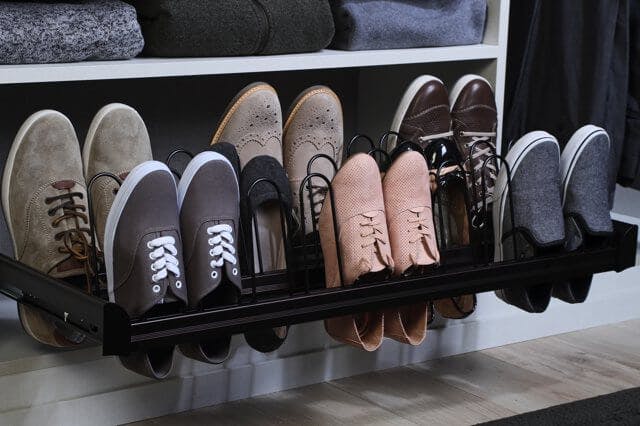 A sliding shoe rack that stores shoes vertically