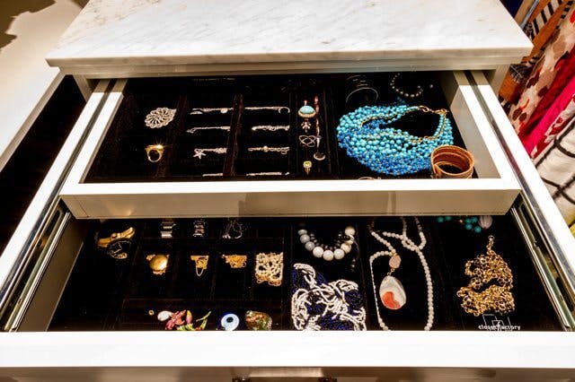 two drawers showing jewelry being stored