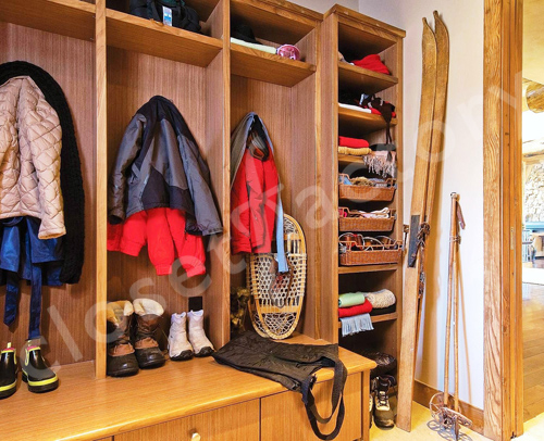 A mudroom with clothes in it