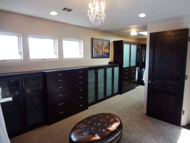 A large walk-in closet full of windows