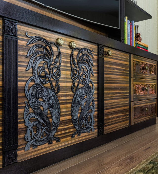 An entertainment center with striped wood and detailed inlays