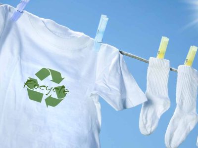 Clothes drying on a clothes line with a recycle logo