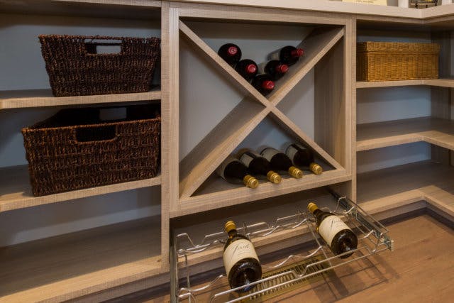 A wine rack inside a pantry
