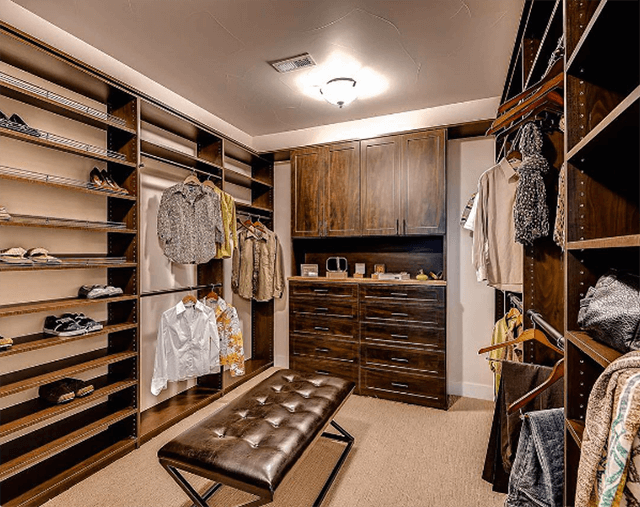 A brown wood men's closet