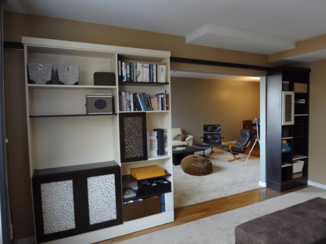 A book case that slides aside to reveal a hidden room