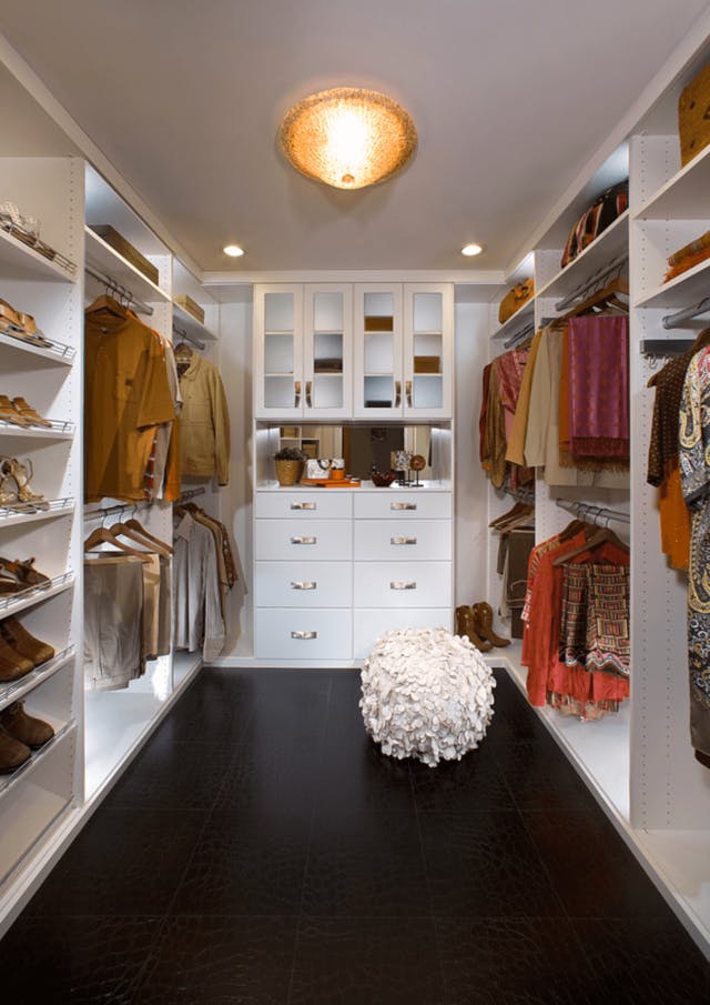 A pretty white walk-in with clean lines and black floor