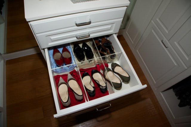 A shoe drawer showing how transparent compartments work to organize shoes