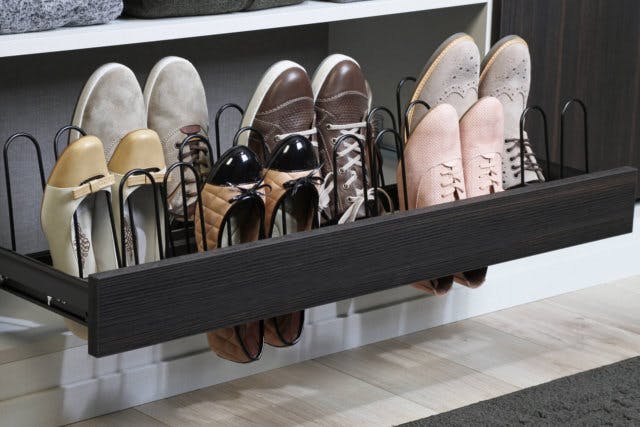 a pull-out shoe rack allows you to fit more shoes in the same space while still keeping them visible