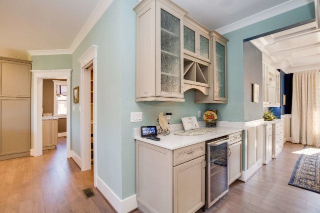 Pantry wall unit added to a blnk wall to increase storage.