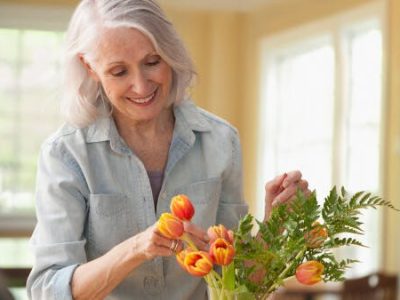 woman creating a flower arrangement
