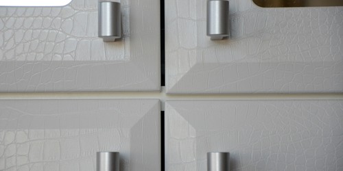 Close up of the Faux White Alligator Faces detail designed for Jill Zarin's Wall Unit.