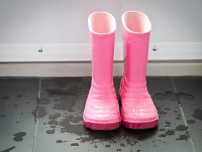 pink rain boots on floor