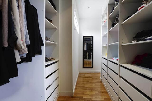 A hallway in a white closet