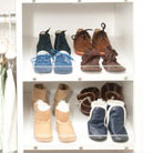 Shoes on slanted shoe shelves