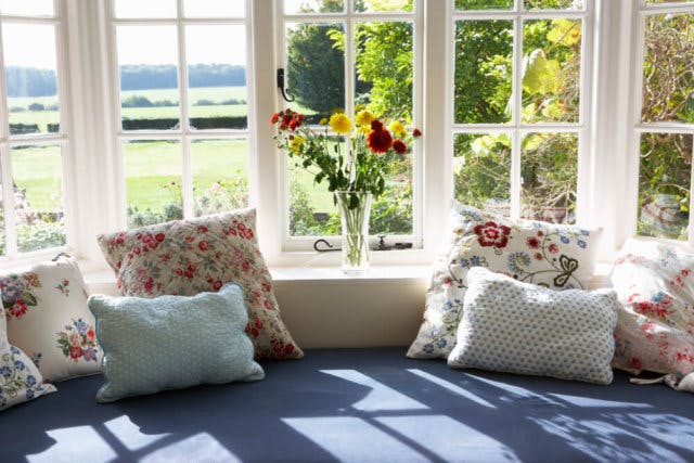 A sunlit bay window bench