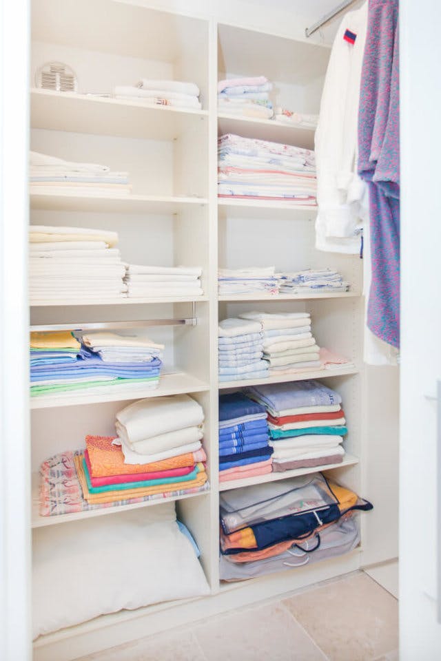 A linen closet, organized by color