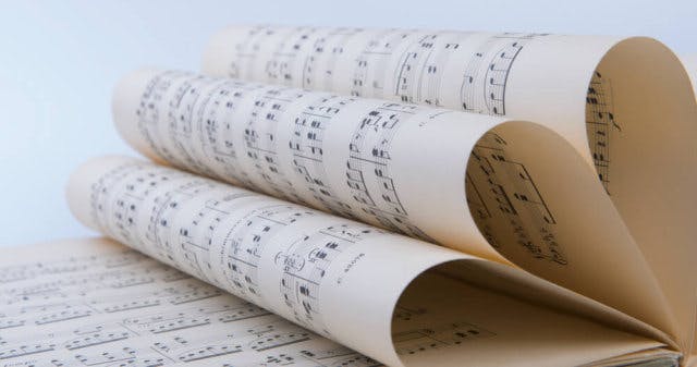 Music notation folded in on itself