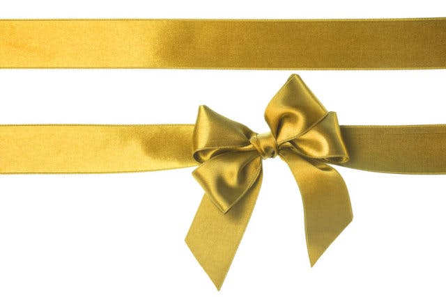 A gold ribbon with a double bow