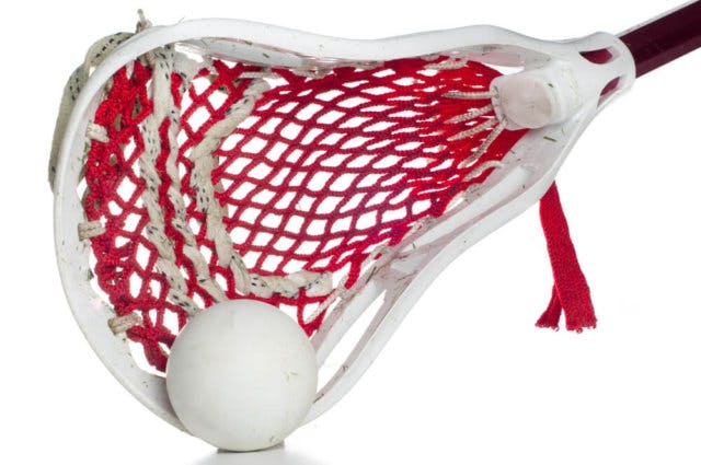 A lacrosse stick and ball