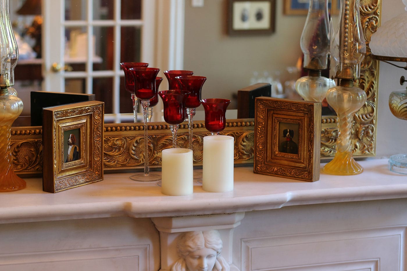 grouping of picture frames on a fireplace mantel