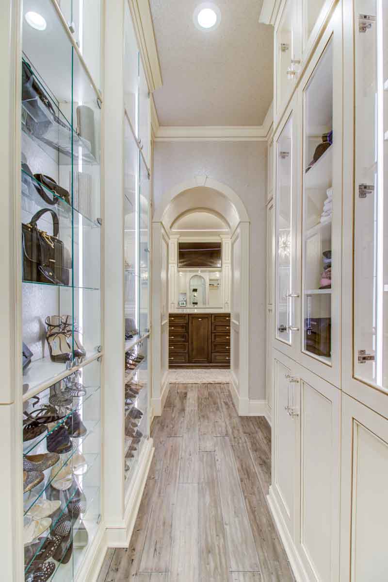 Custom dressing rooms with display cabinetry.