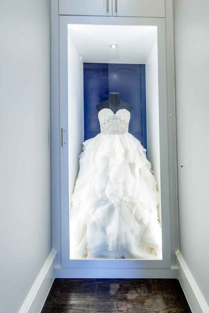 Custom closet system that showcases wedding dress