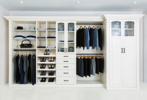 closet organizer in antique white with paibted trim moldings