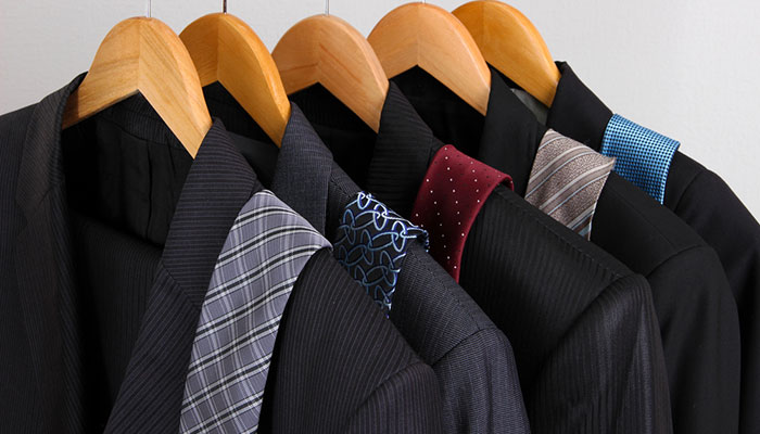 jackets on hangers with tie drapped over