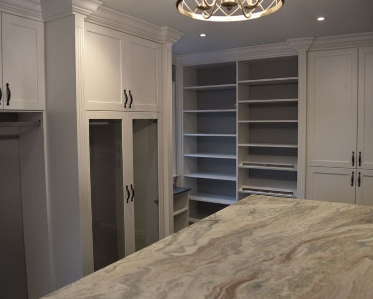 white custom closet with an island