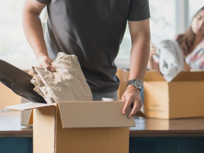 packing clothes into box
