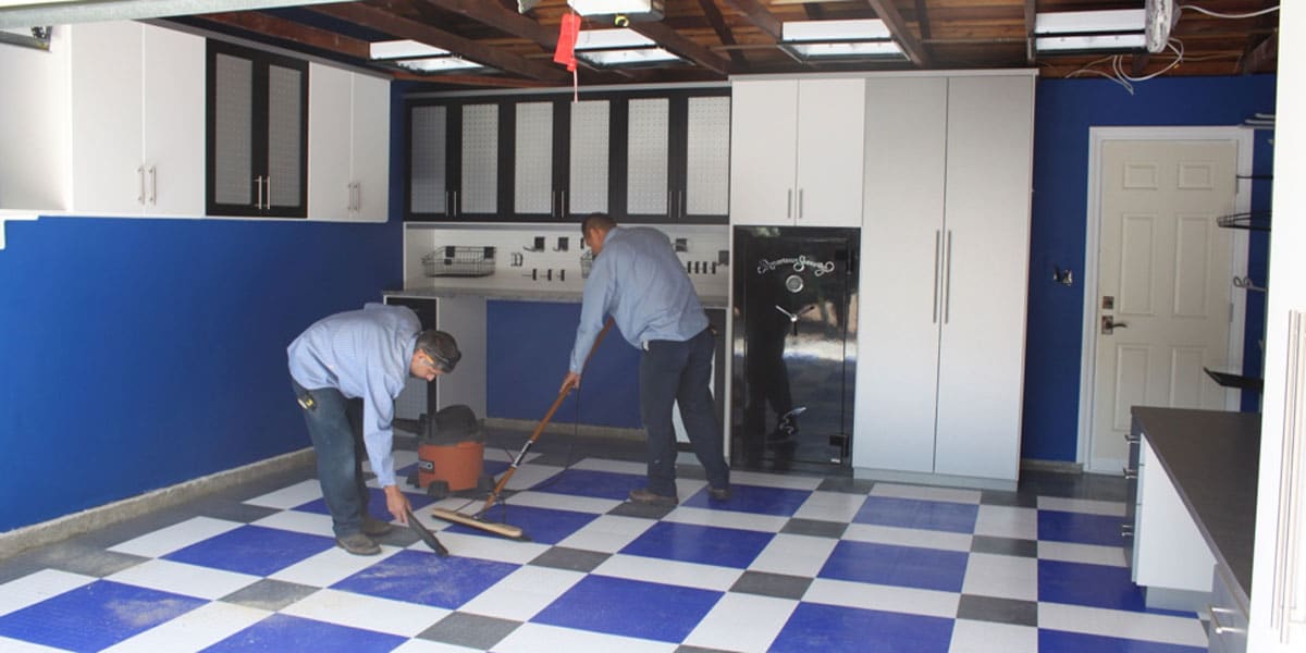 2 men working on a custom garage build