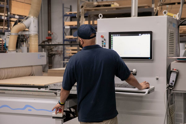 man working in factory at machine