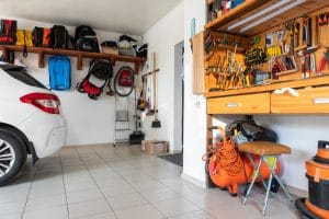 A home garage with storage solutions and a car